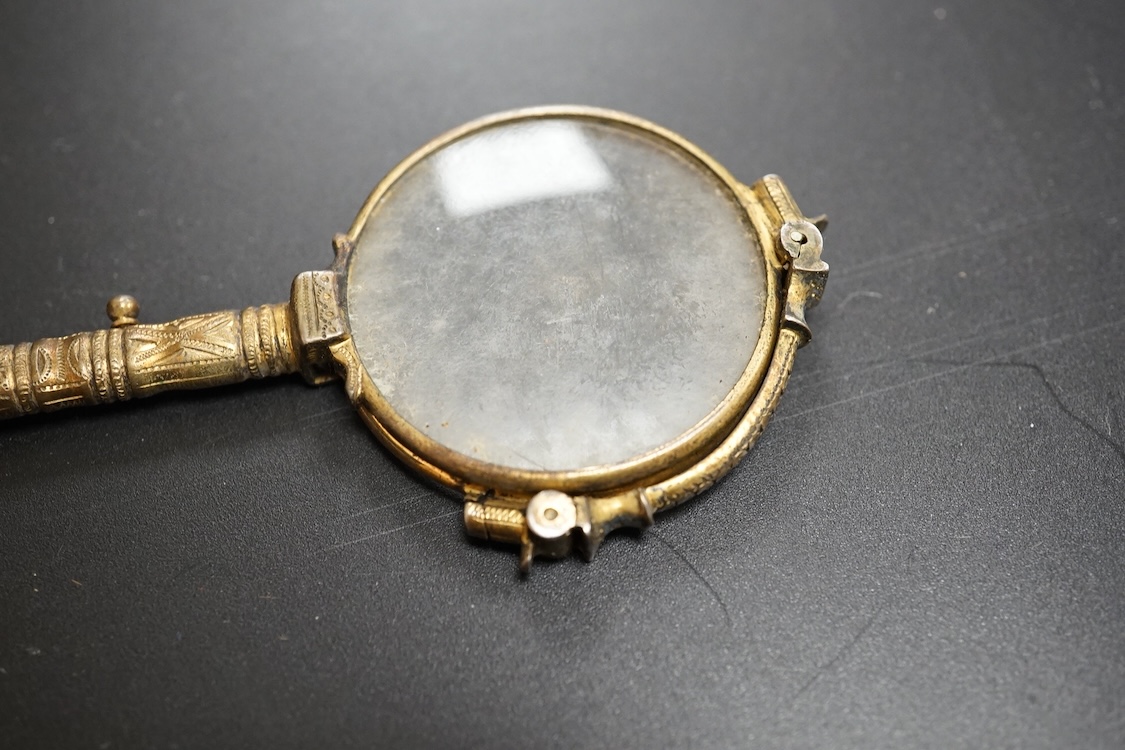 A pair of mother of pearl handled gilt metal lorgnettes in a leather case and a comb housed in an antimony case, largest 16cm in length